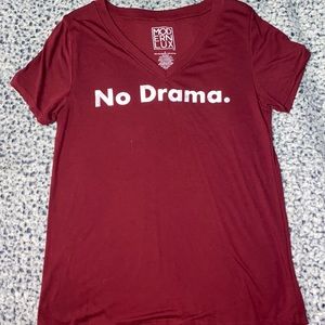 A red t-shirt, never worn. Loose fitting, thin, soft fabric.